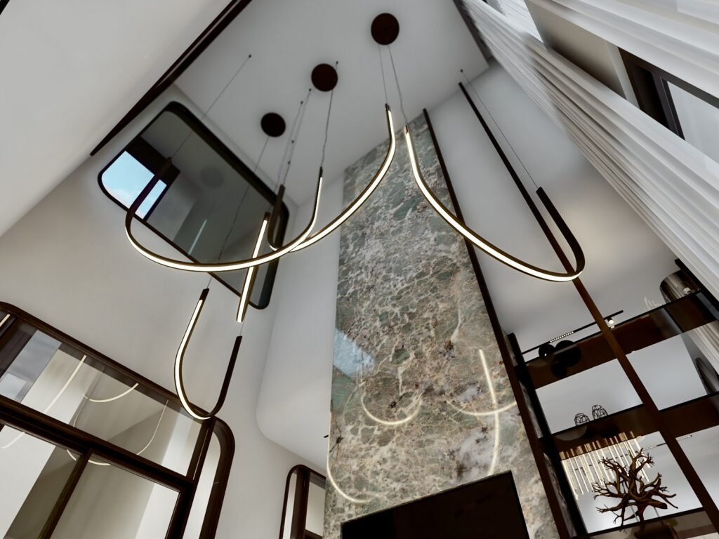 View up to curved sculptural pendant lights and a full-height marble wall in the double-height living room