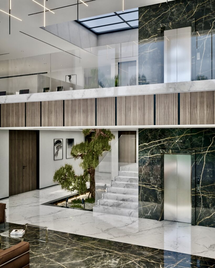 NIGP headquarters double-height atrium with a marble staircase, indoor tree and glass balustrades