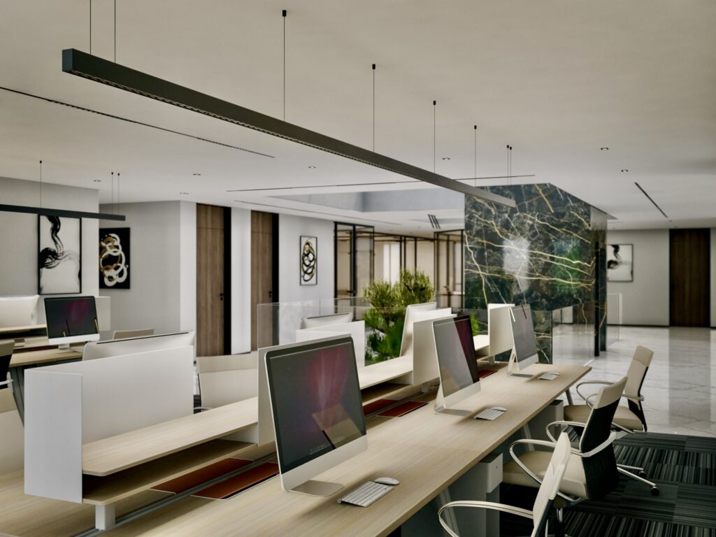 NIGP headquarters open-plan office with white workstations, linear lighting and a marble feature wall