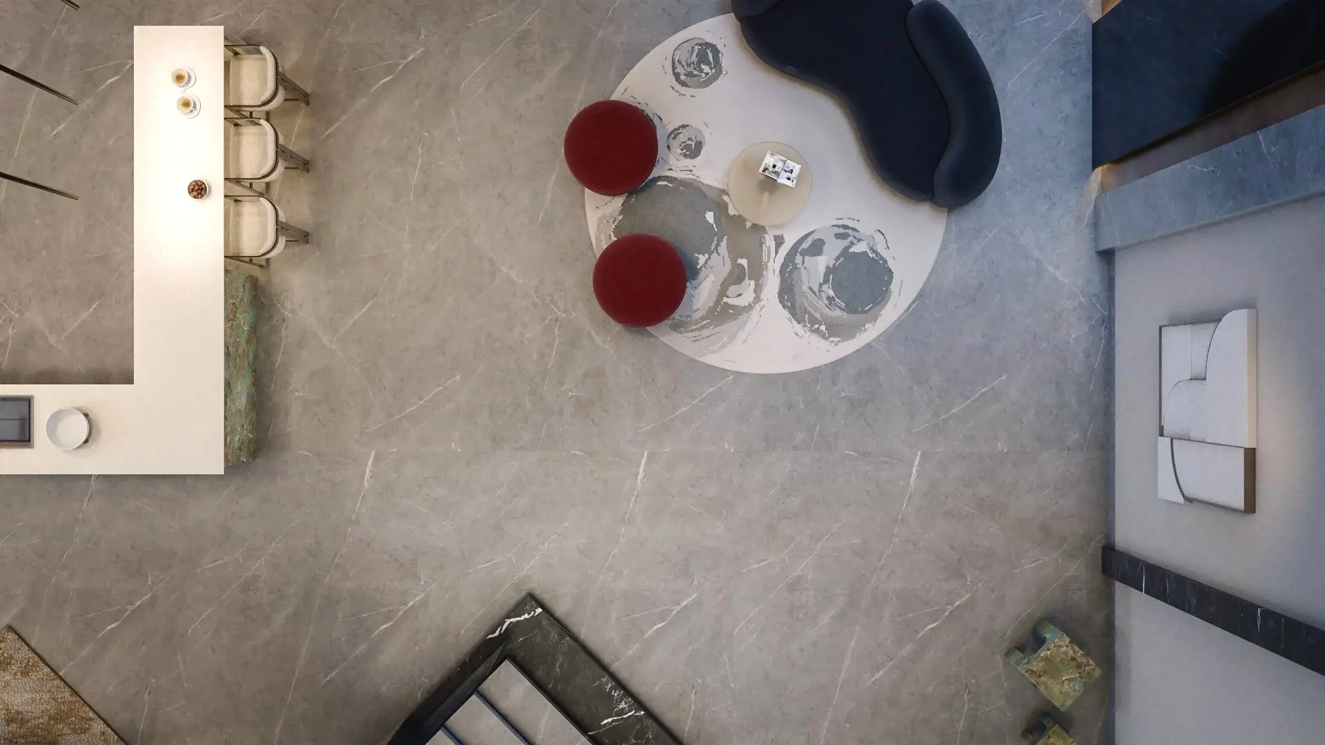 Entrance hall seen from above, with a round rug, red ottomans and a marble floor