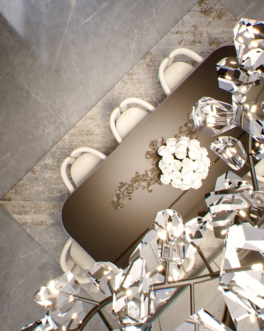 Dining table seen from above beneath a crystal chandelier